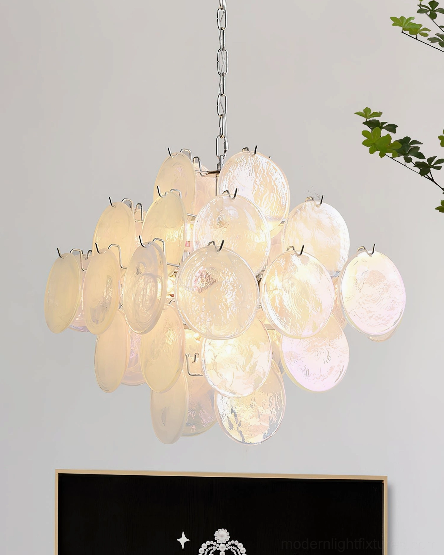 Contemporary Murano glass disc chandelier resort hotel architecture view capturing luxury hospitality aesthetic