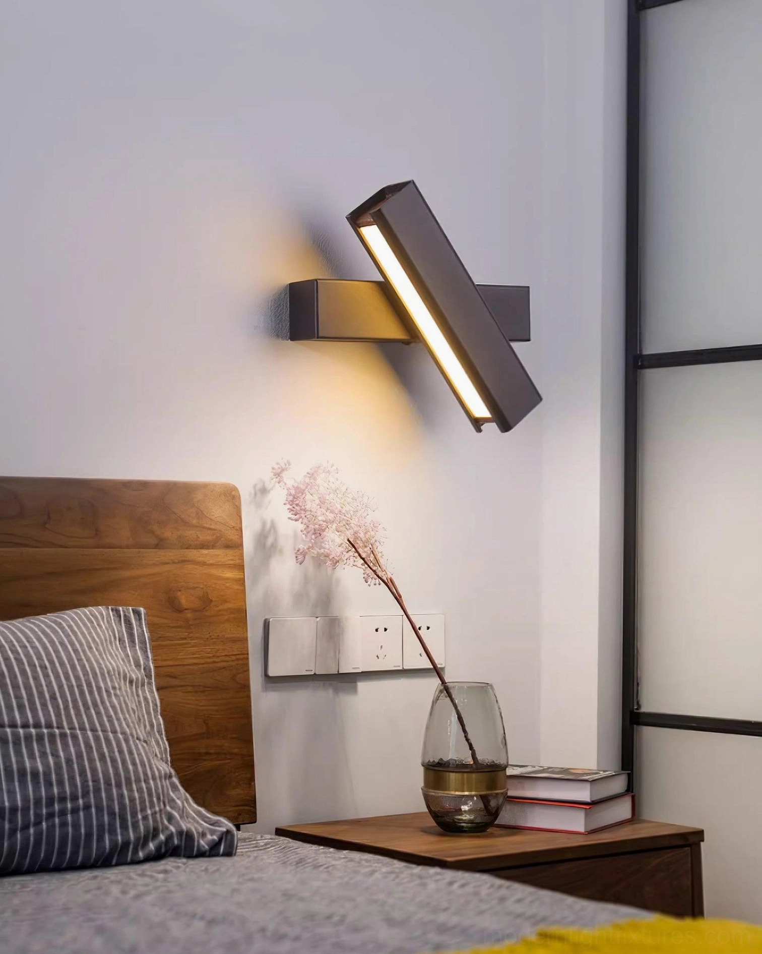 Contemporary Nordic wall sconce mounted as bedside reading light with 50000 hour LED lifespan