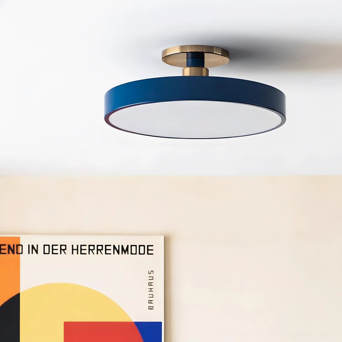 Contemporary ceiling light fixture installed overhead showing navy matte frame and brass gold hardware