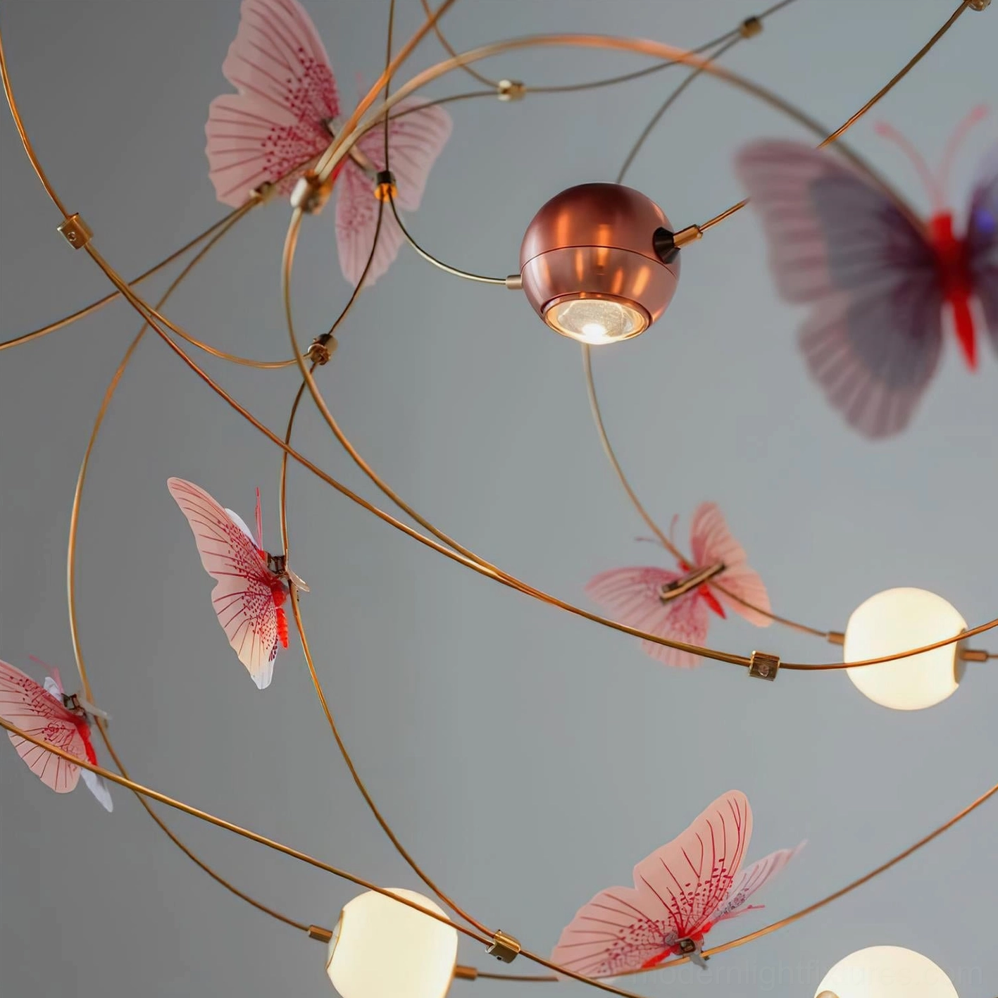 Contemporary pendant chandelier with butterfly ornaments and brass curved framework creating modern artistic lighting statement