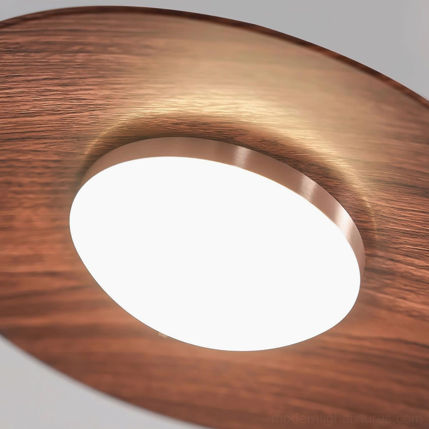 Contemporary pendant lamp with matte black metal arm and natural wood disc in styled interior