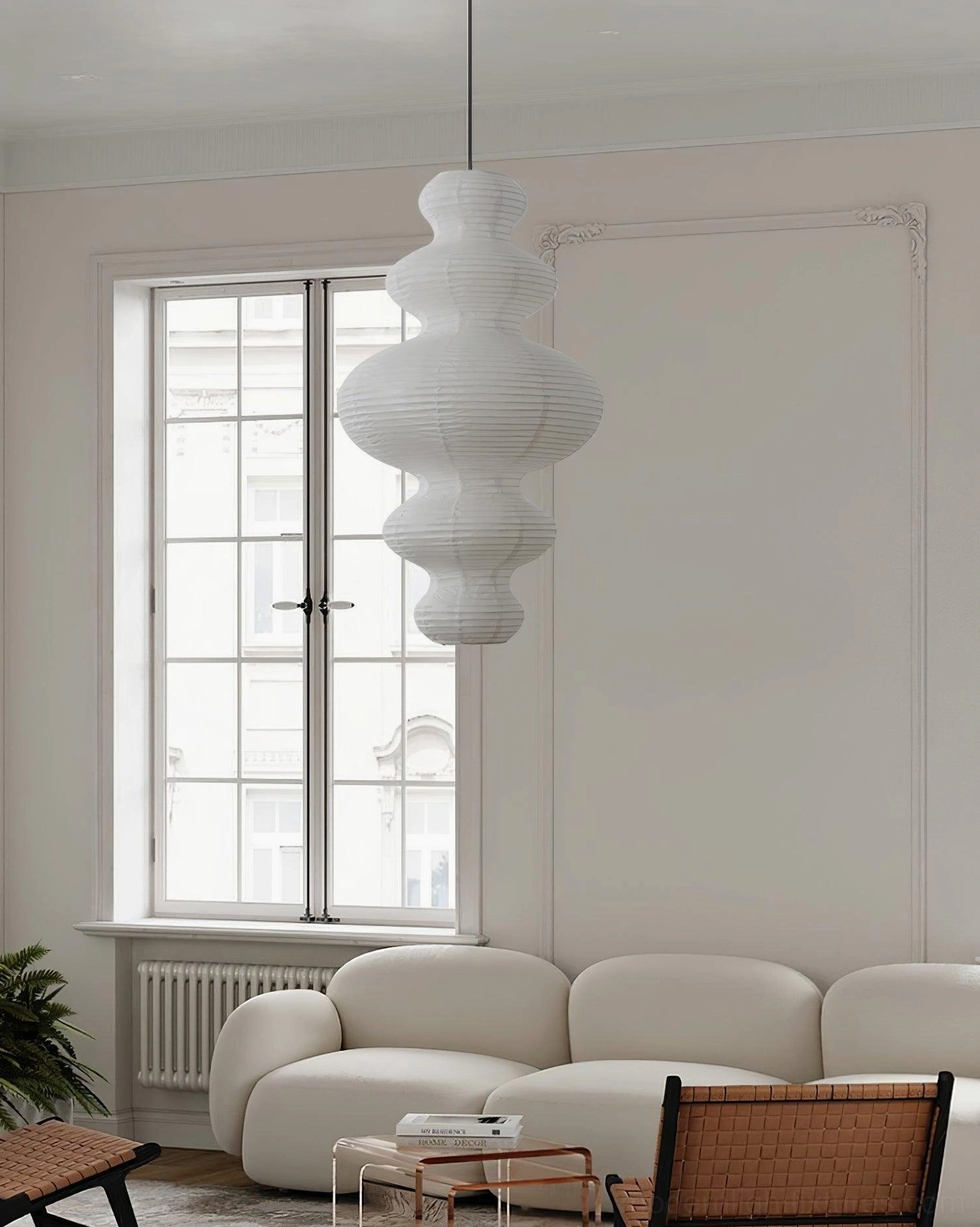 Contemporary pendant lamp side angle view in formal living room with French minimalist decor aesthetic