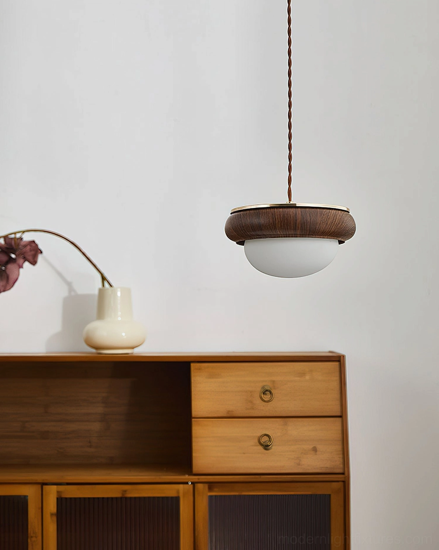 Pendant lighting with dark walnut wood top ring flat frosted white shade in modern home interior