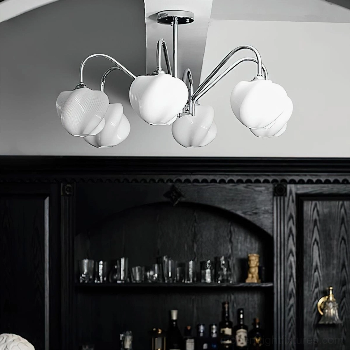 6-head sculptural chandelier installed in contemporary home bar, low-angle upward view showing warm glowing acrylic shades and curved chrome arms