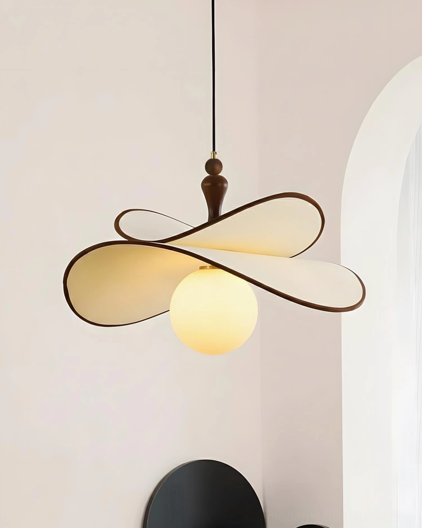 Contemporary petal pendant lamp showing warm fabric petals with wooden accents and illuminated glass orbs creating ambient modern lighting fixture