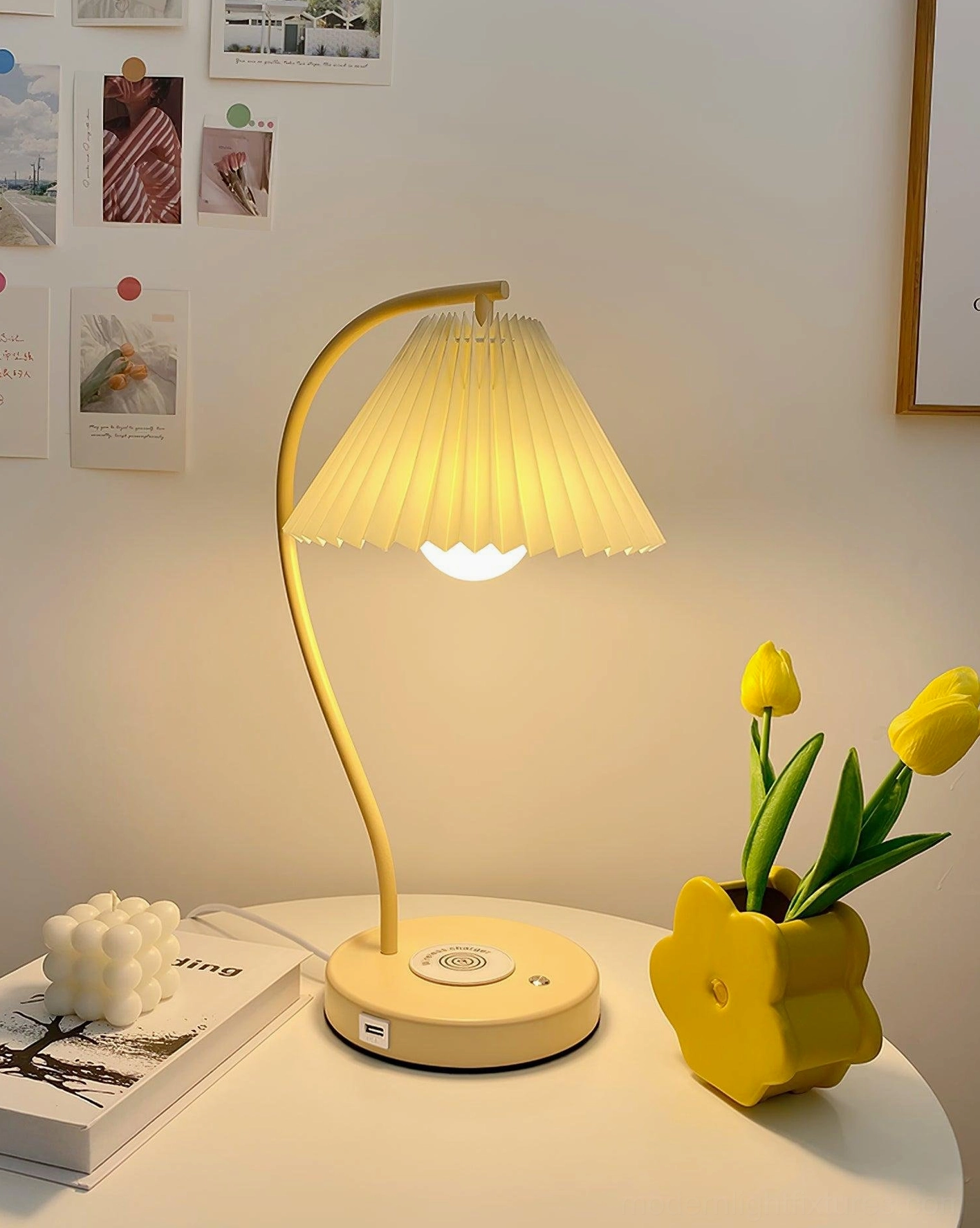 Modern desk table lamp with pleated shade in home workspace setting