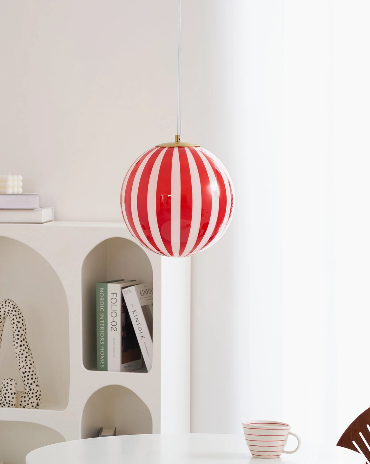 Contemporary design red striped spherical pendant light architectural detail photography