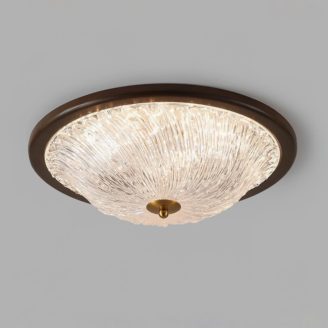 Contemporary flush mount ceiling light with deep rippled glass dome and dark wooden base - brass center detail