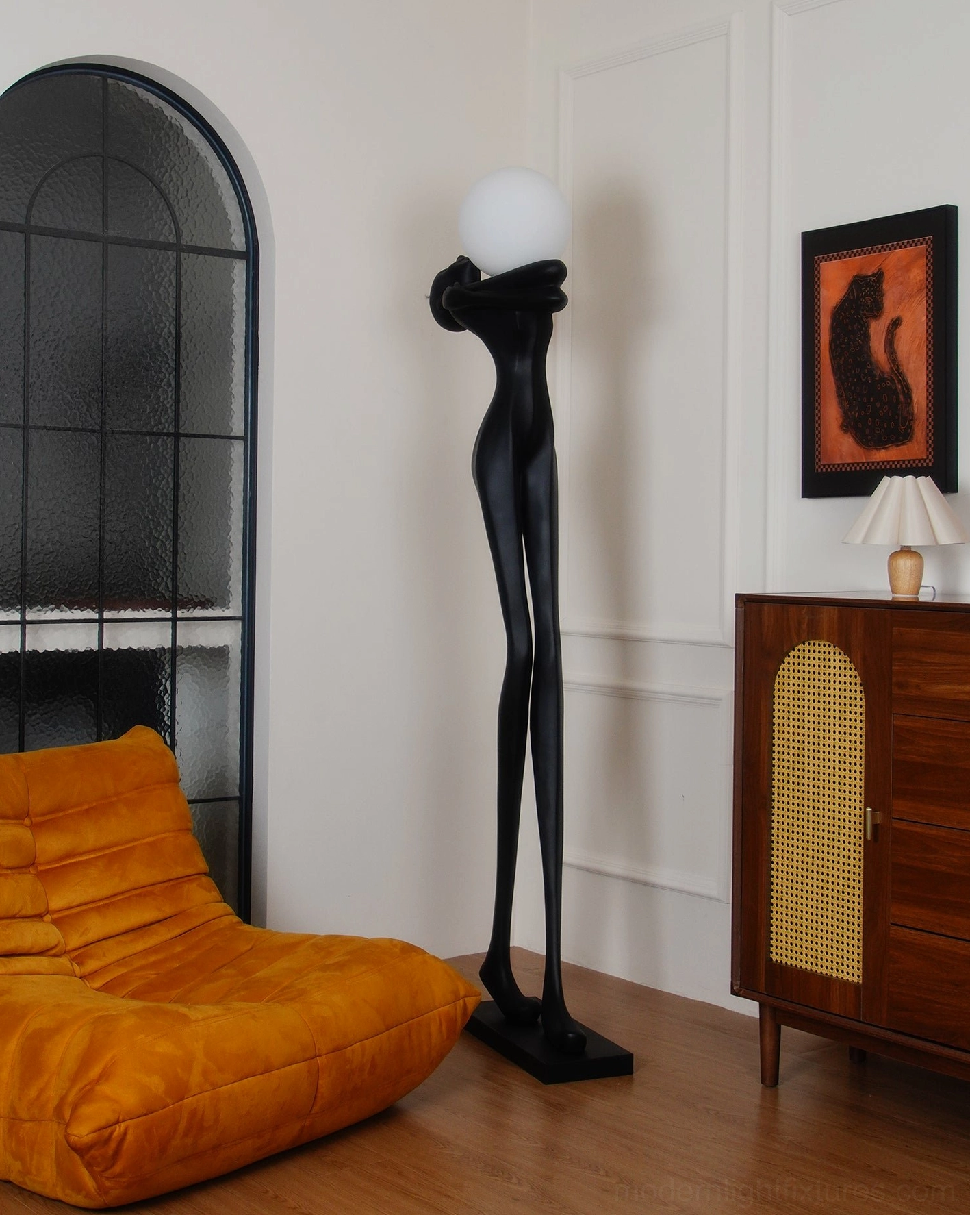 Black sculpture floor lamp contemporary interior, artistic human form silhouette, modern home lighting