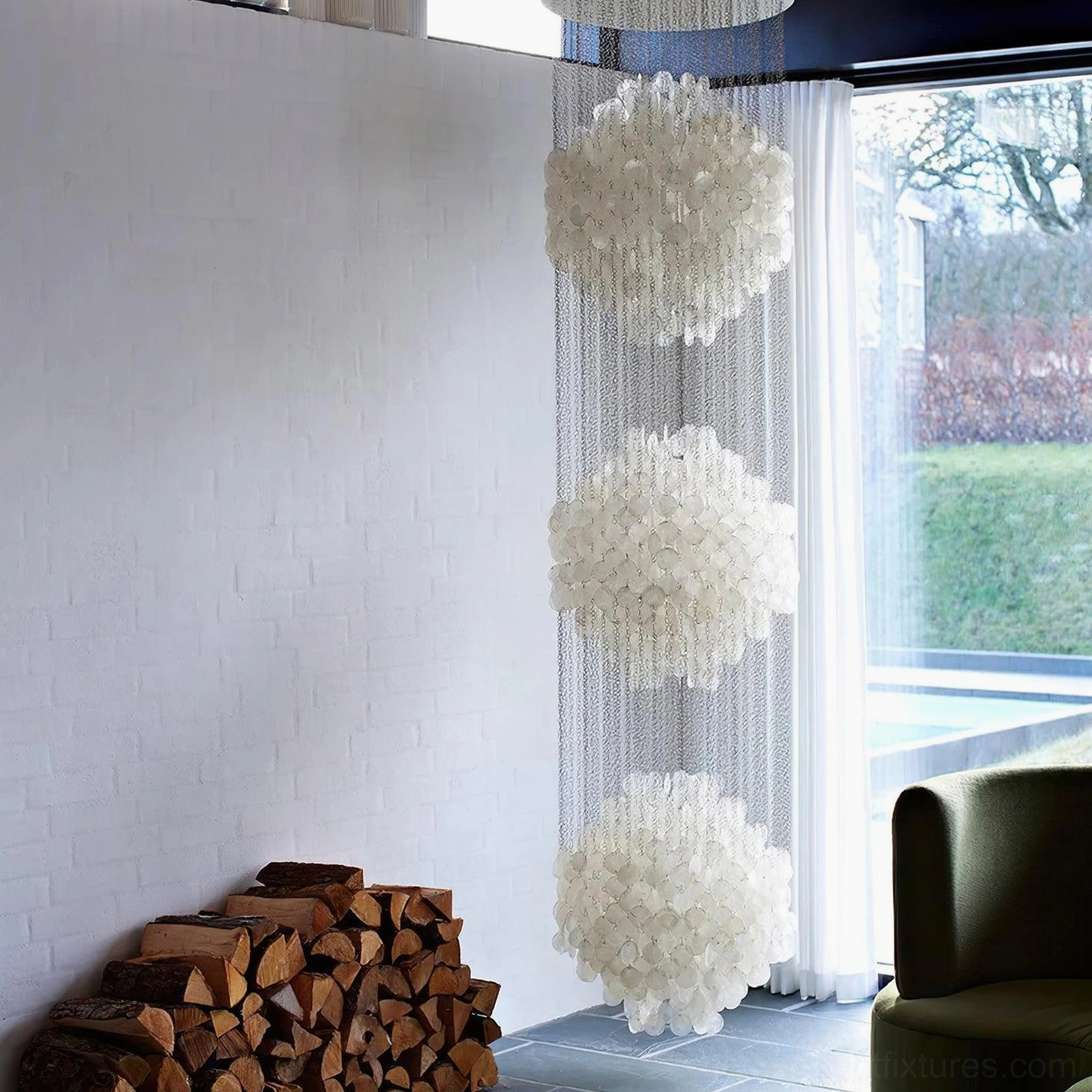 Contemporary capiz shell chandelier with metal suspension showing sculptural light-diffusing design principle