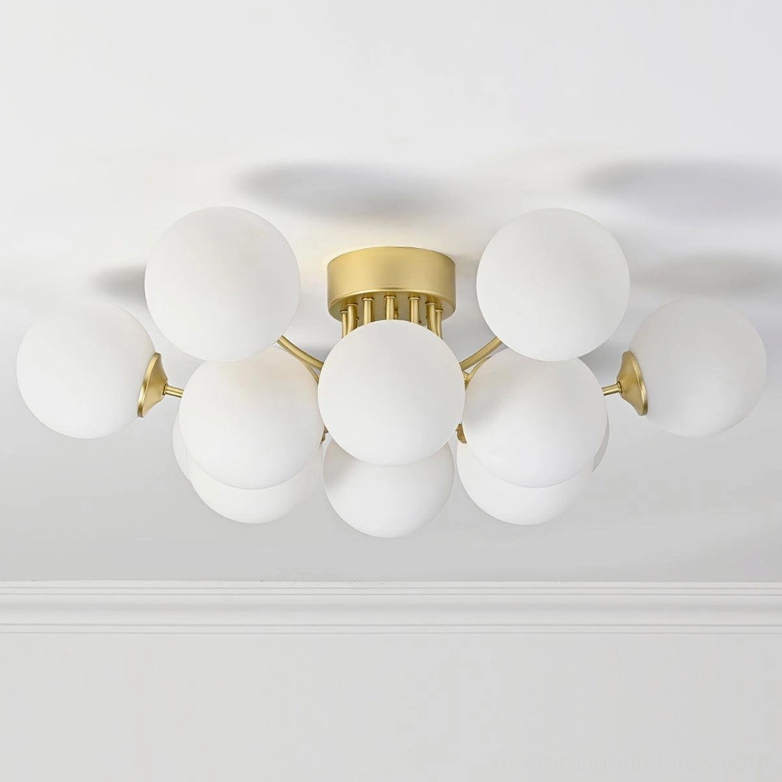 Contemporary sputnik ceiling light with brass gold accents in modern home interior environment