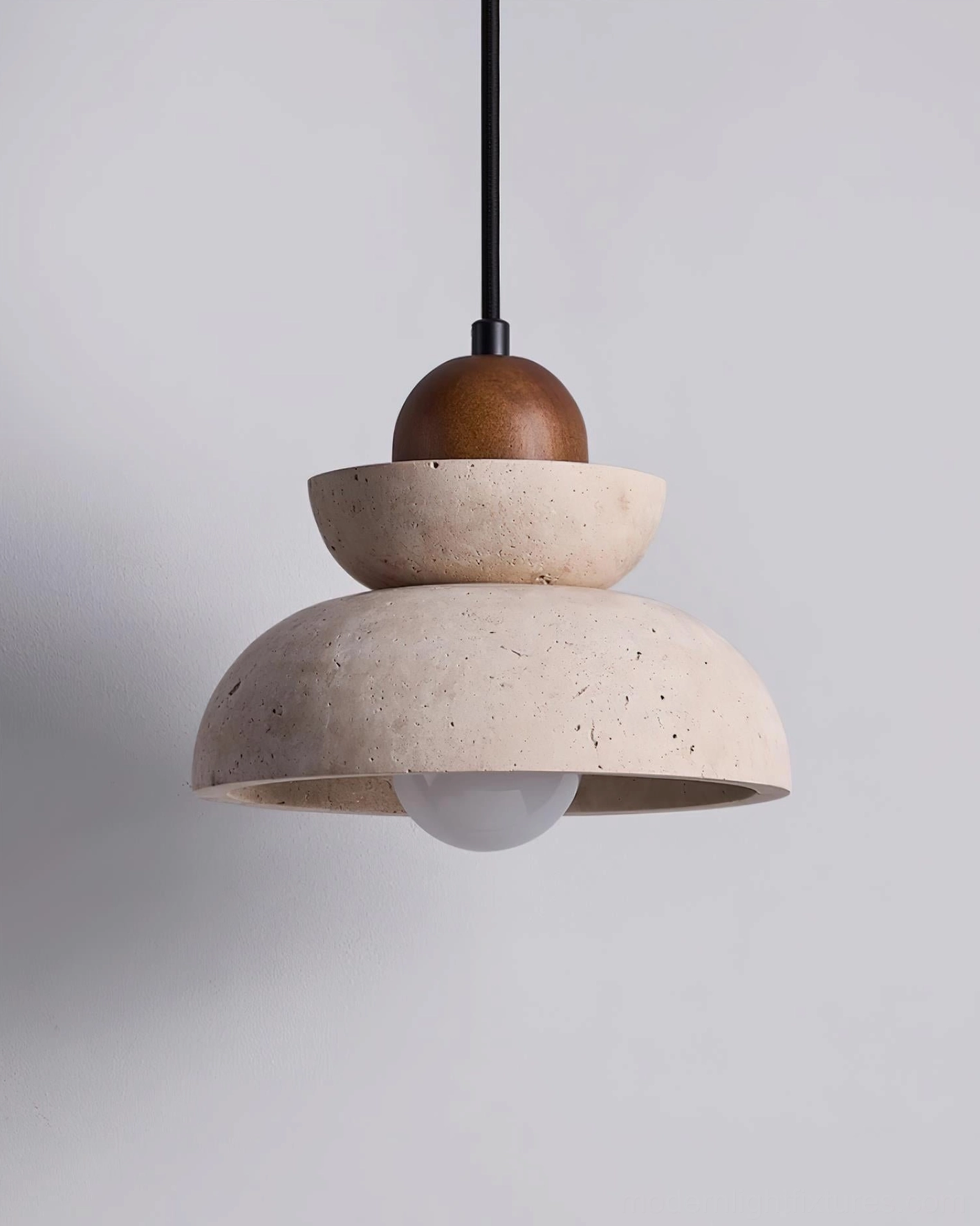 Contemporary pendant fixture with stacked travertine elements and black metal frame