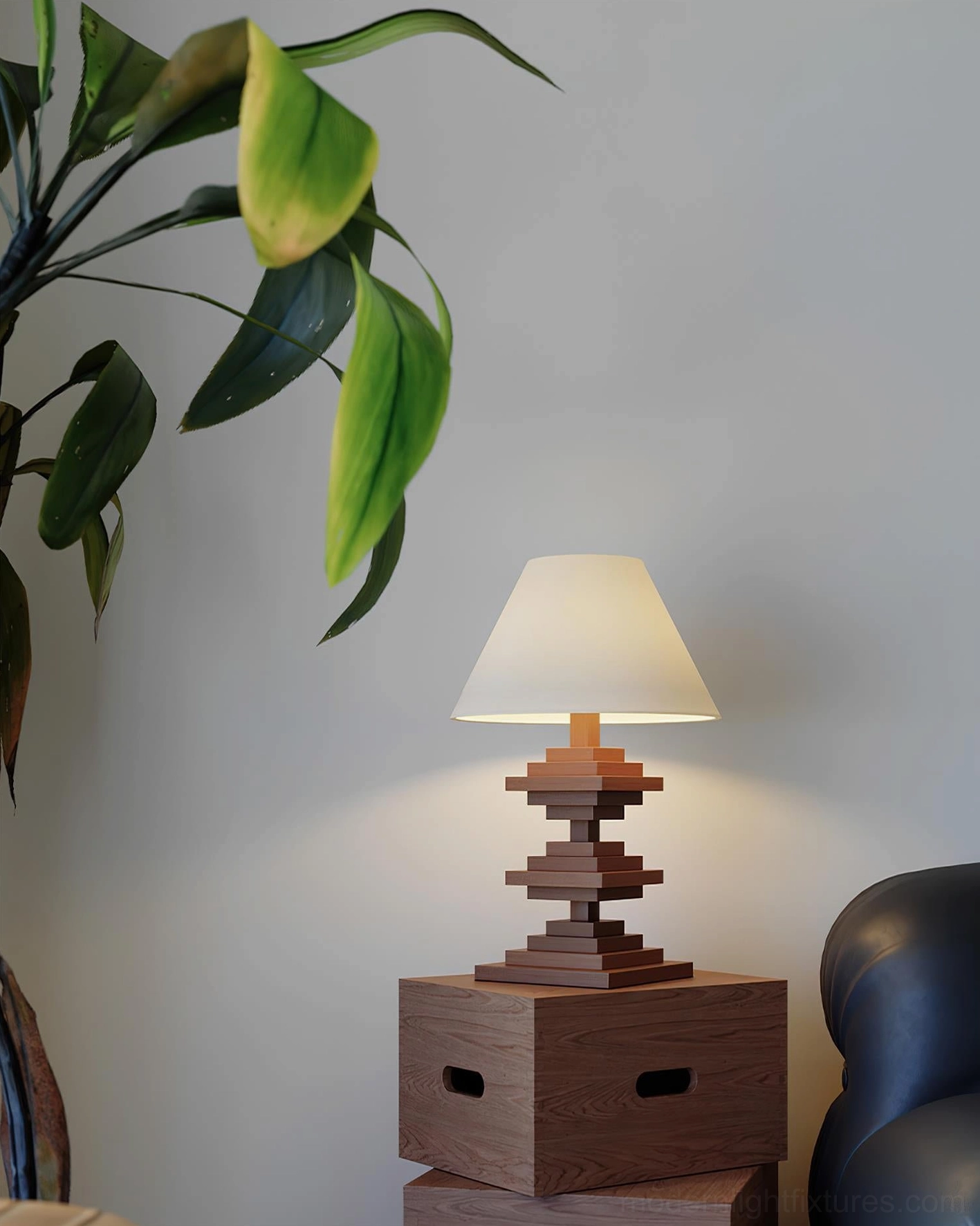 Geometric tower table lamp positioned in contemporary living room with ambient warm lighting and interior design accessories