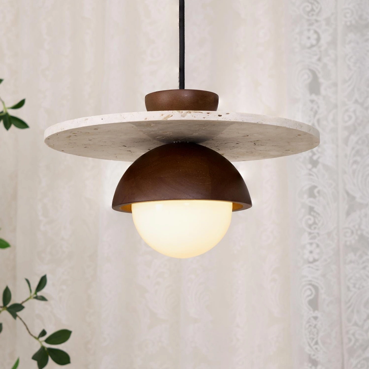 Contemporary travertine pendant ceiling fixture with warm ambient light for modern living spaces