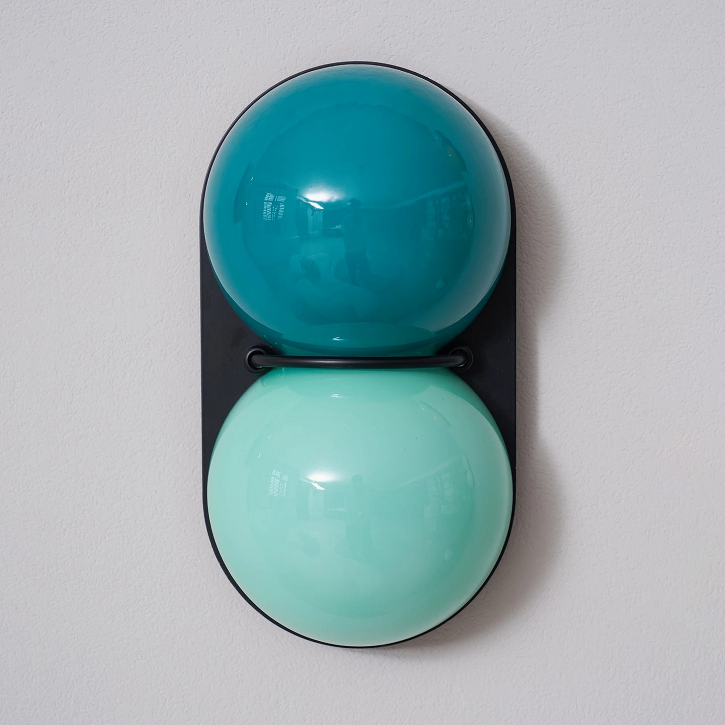 Contemporary Twinwave wall light sconce with dual glass orbs in refined modern home