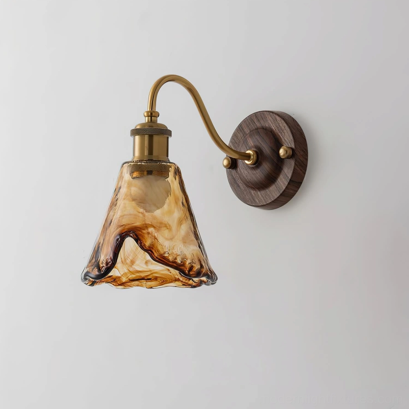 Contemporary wall lamp side angle view showing elegant brass and glass construction in home setting