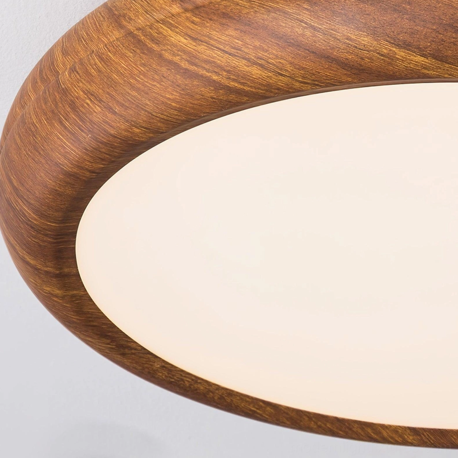 Walnut wood grain round flush mount ceiling light fixture installed in contemporary home, architectural lighting design