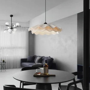 Contemporary rippled pendant light suspended in modern minimalist dining and living room space