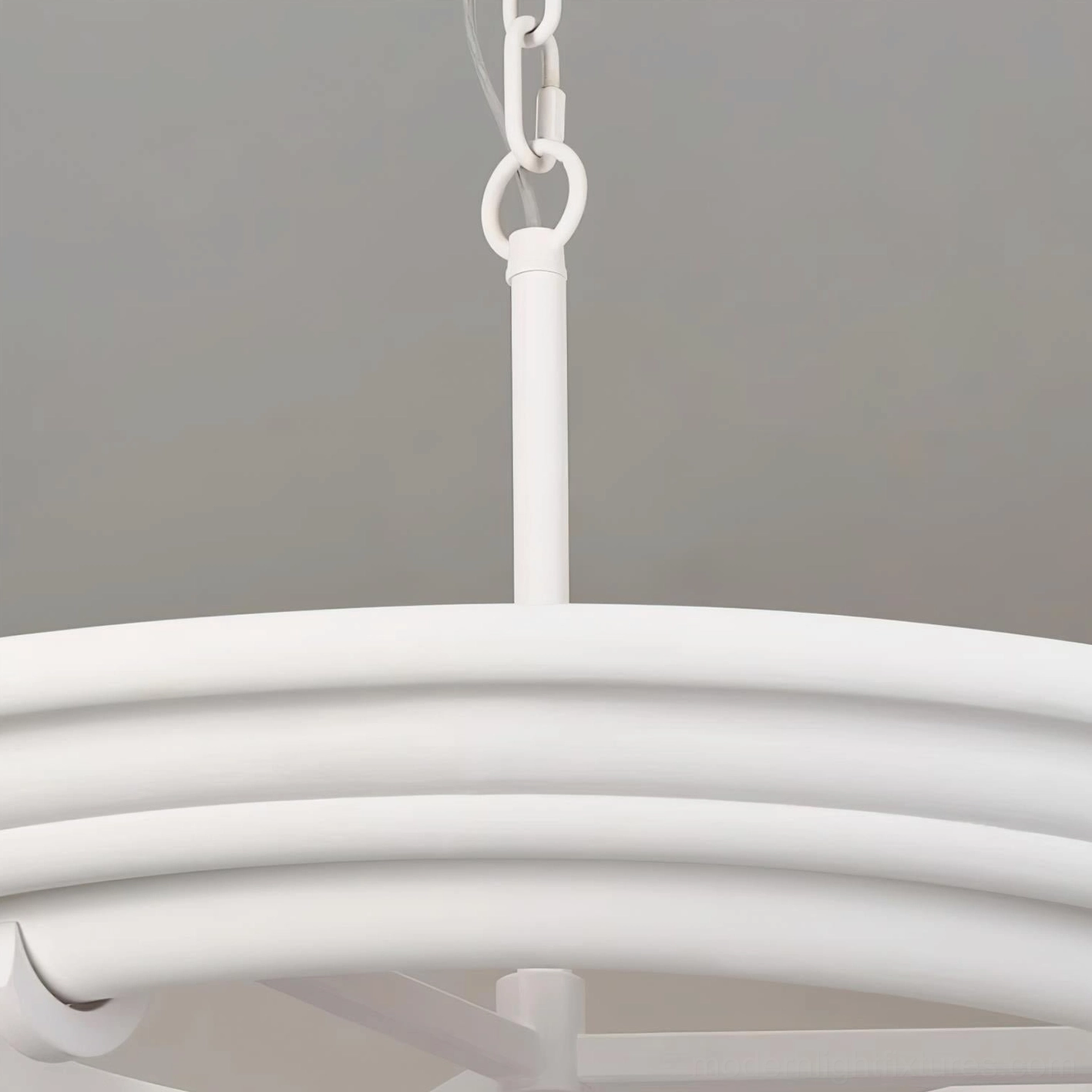 Contemporary white plaster chandelier showing sculptural ring construction and minimalist style