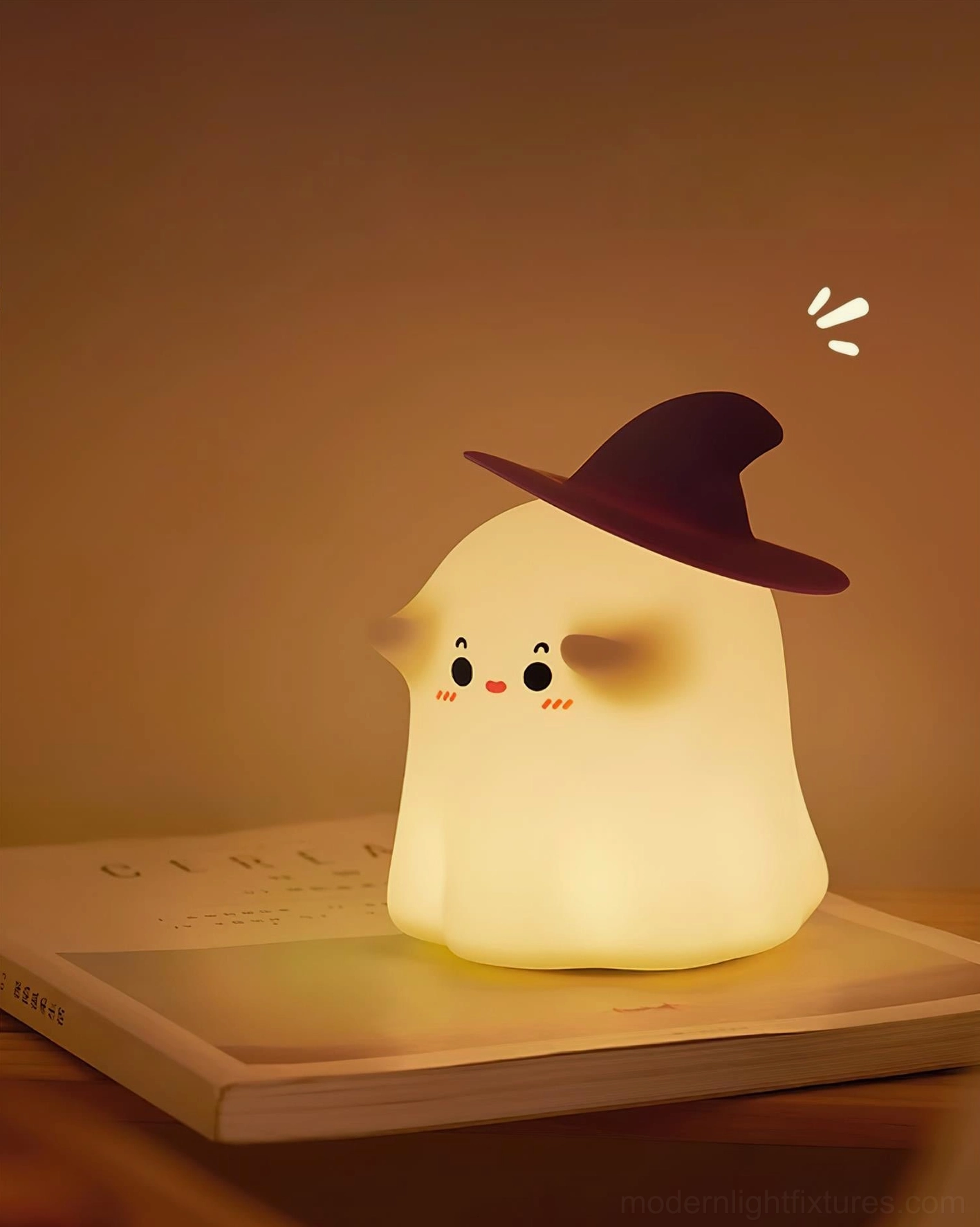 Minimalist witch ghost night light on desk tabletop with book, warm home decor aesthetic