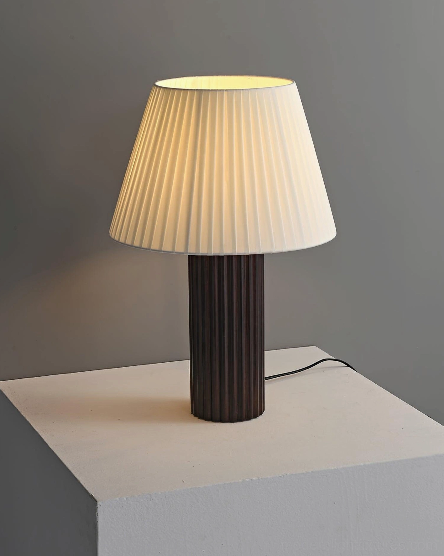 Ribbed wood contemporary table lamp with pleated fabric shade perfect for modern minimalist interior design and ambient home lighting solutions