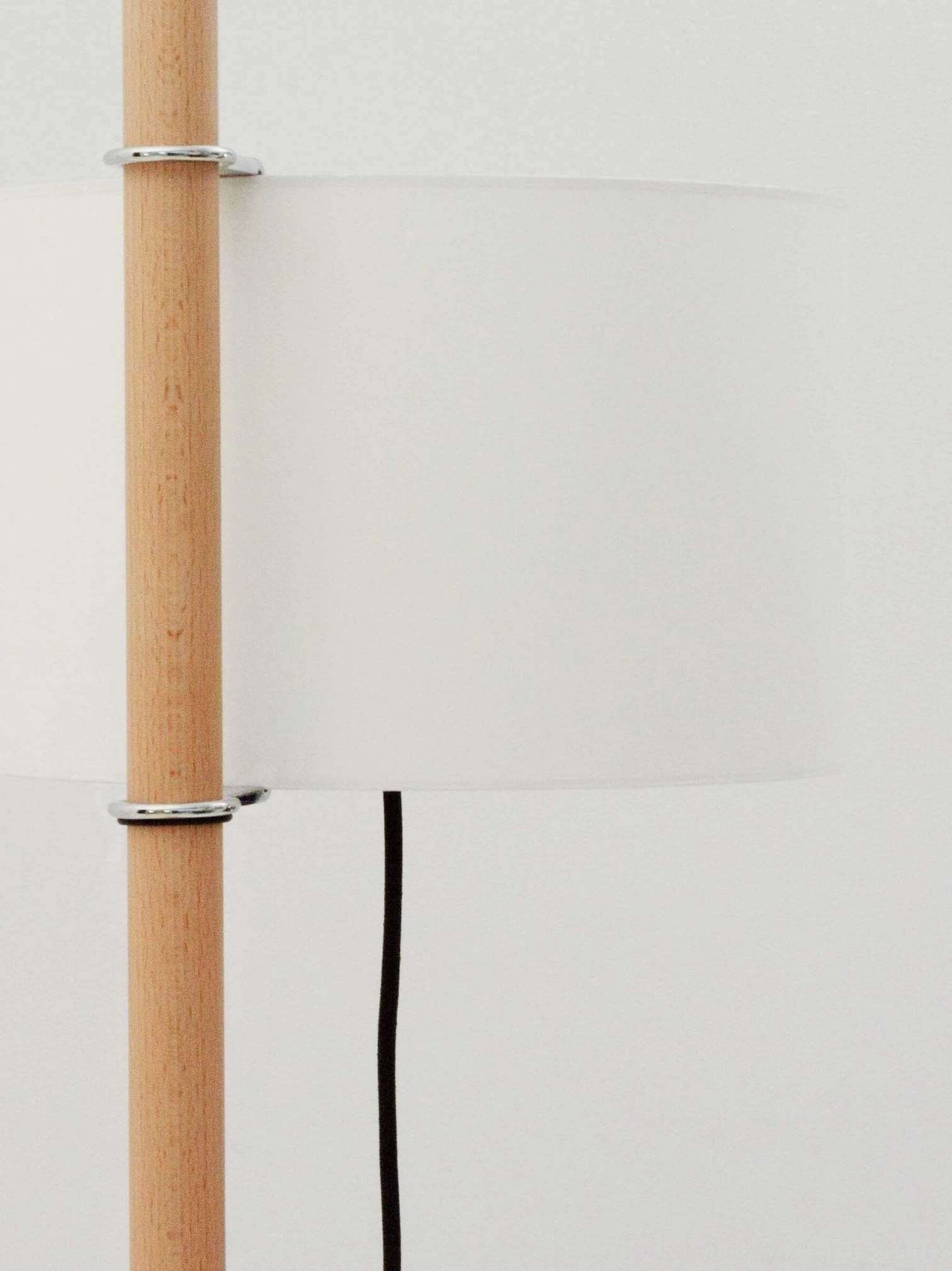 Contemporary floor lamp with wooden pole and drum shade, versatile modern home lighting