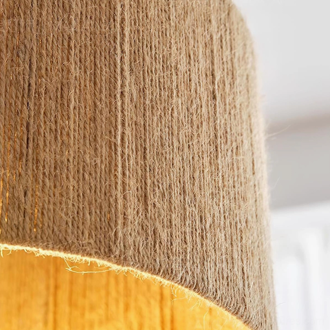 Contemporary woven pendant fixture with natural jute shade and warm wood frame, minimalist design