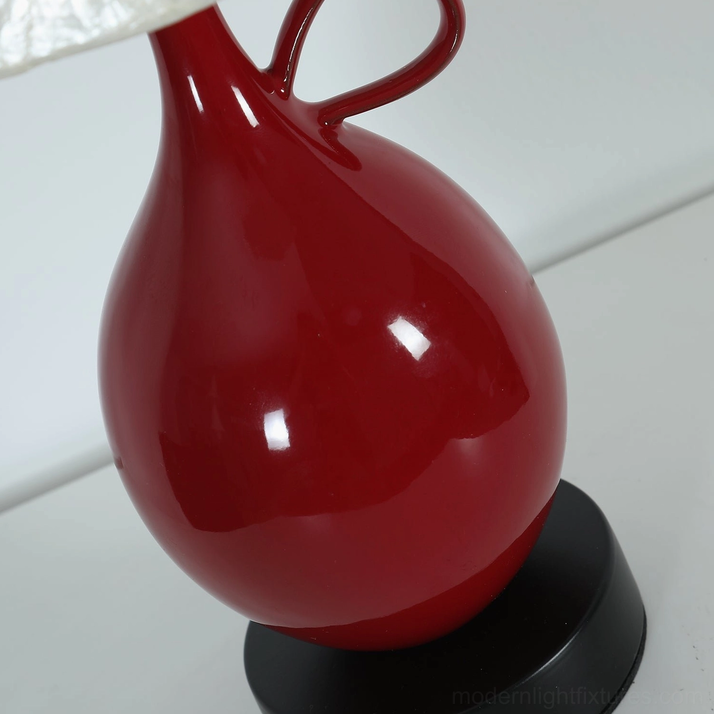 Coravie table lamp base and shade assembly highlighting glazed ceramic craftsmanship and capiz shell construction details