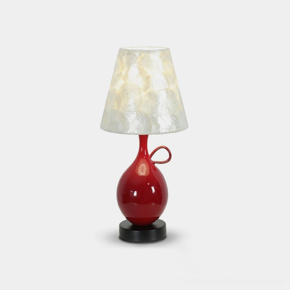 Coravie red ceramic table lamp with capiz seashell shade - frontal studio view showcasing glossy red glazed gourd base with loop handle and pearlescent mother-of-pearl shell tiles