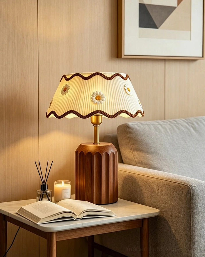 Cordelia cottage daisy embroidered table lamp on cozy living room side table, walnut fluted base with candle and reed diffuser styling