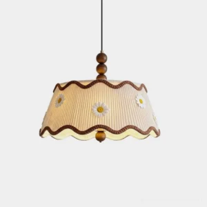 Cordelia pleated fabric pendant light with daisy appliqué and scalloped brown hem, studio shot on white background