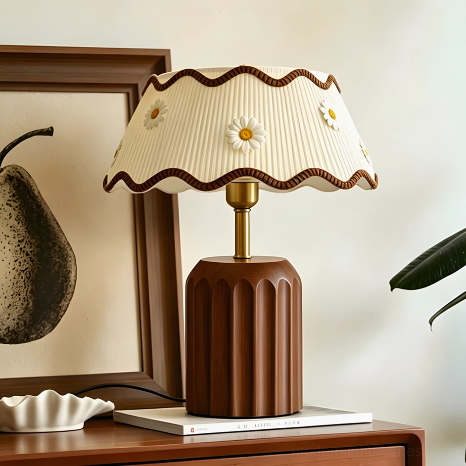 Cordelia vintage table lamp in home interior, three-quarter view showing scalloped shade trim and fluted walnut wooden base beside framed artwork