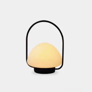 Zoe cordless portable table lamp with integrated carrying handle, black metal frame and frosted dome shade, front studio view