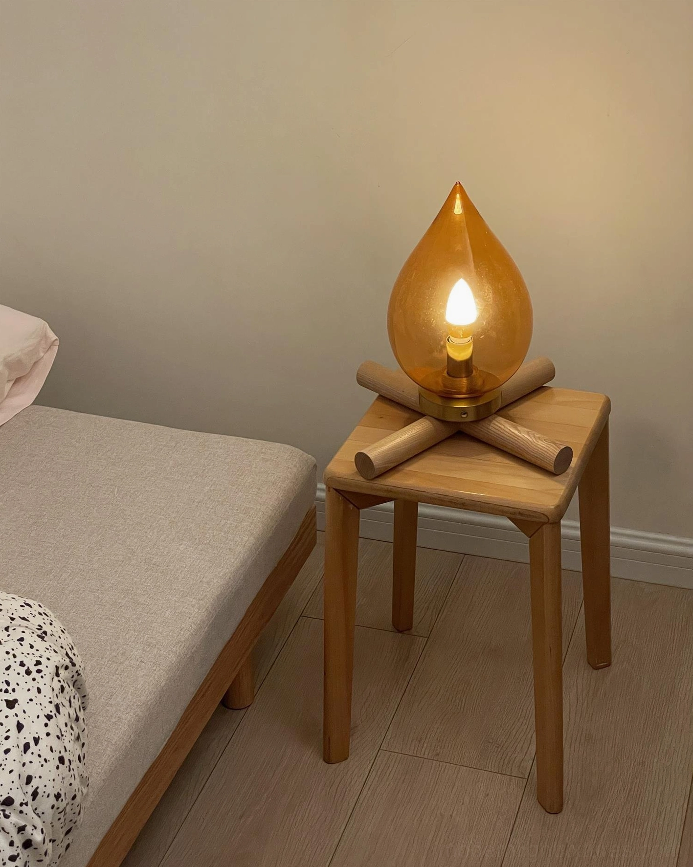 Cordless portable table lamp, warm amber glow illumination in home interior setting