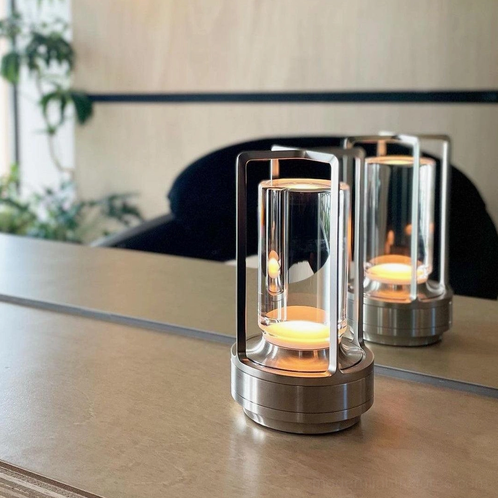 Modern cordless LED table lamp available in multiple finish colors gold silver black clear