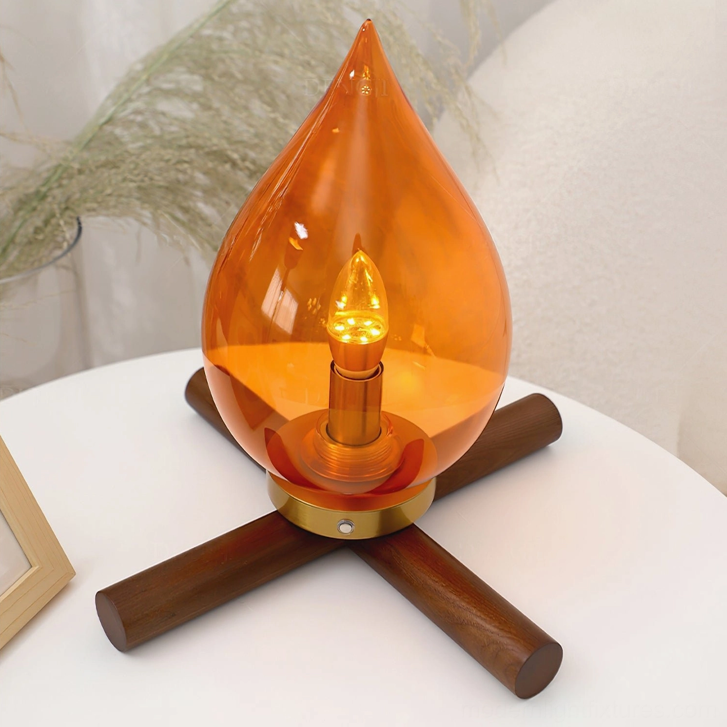 Portable cordless table lamp overhead view on white side table with pampas grass decor