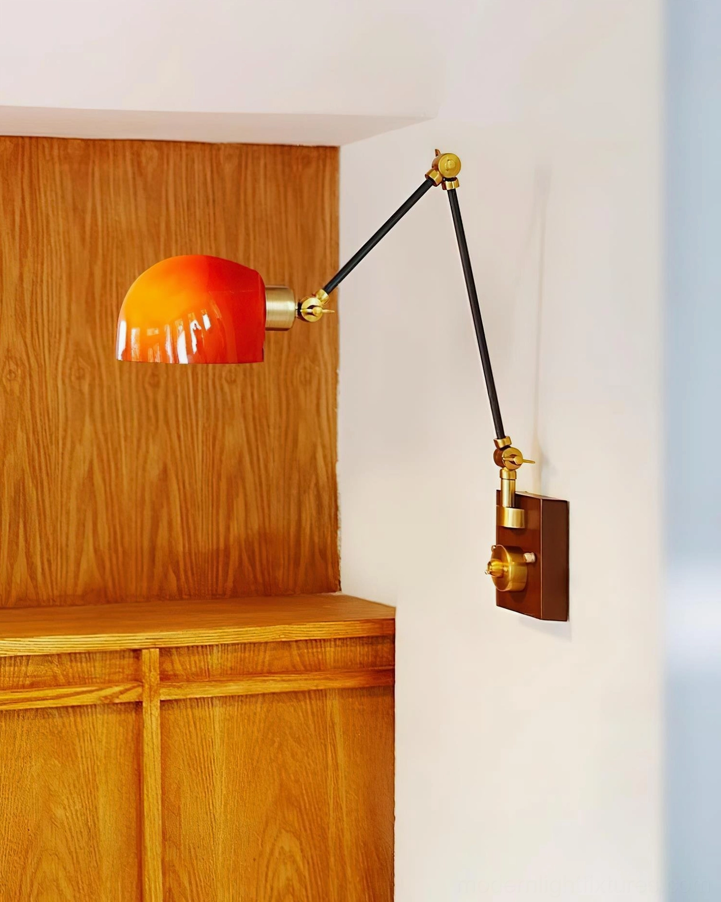 Cordova adjustable wall sconce red dome shade with articulating black and gold arms detail