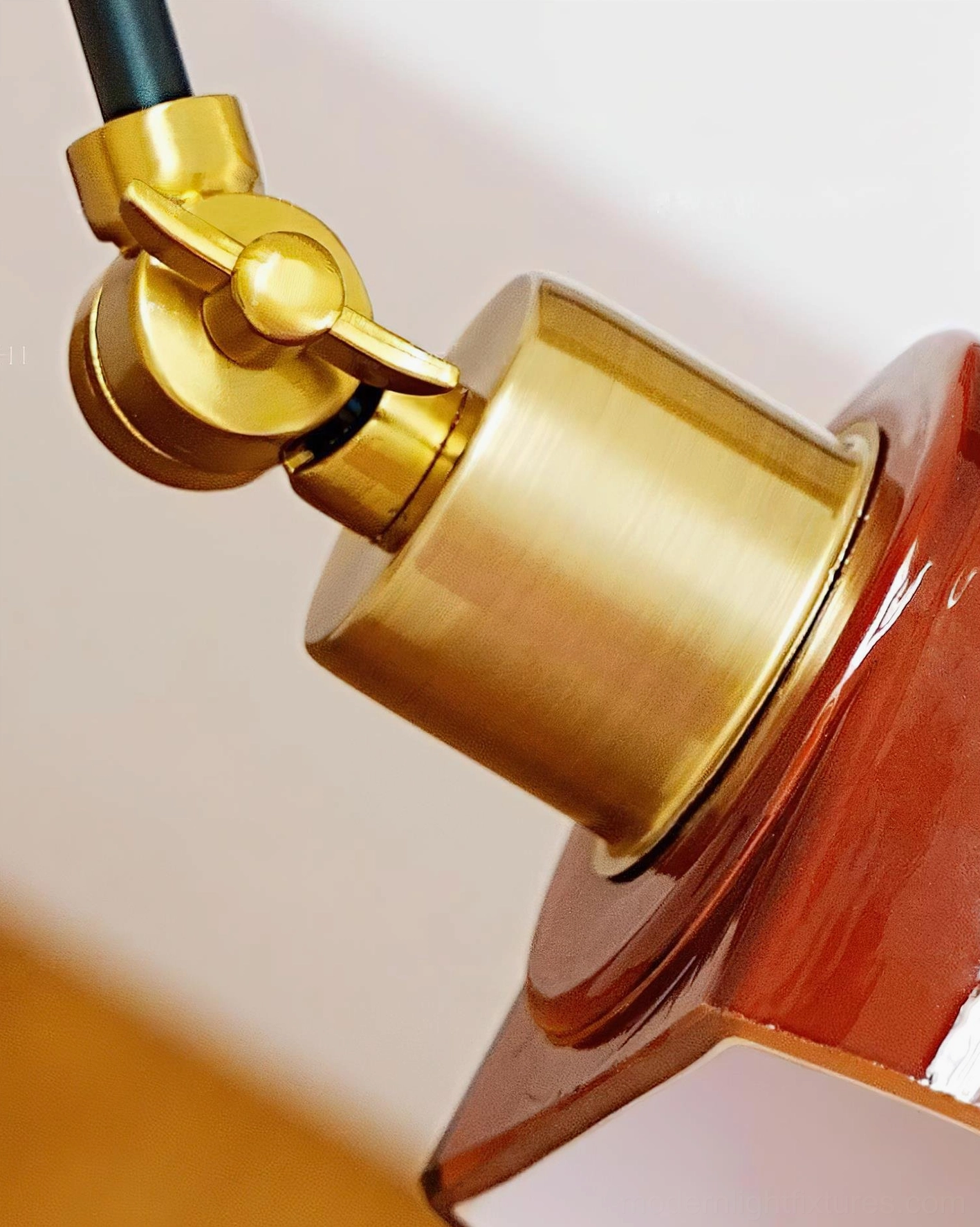 Cordova red dome wall sconce creating ambient lighting accent in styled room setting