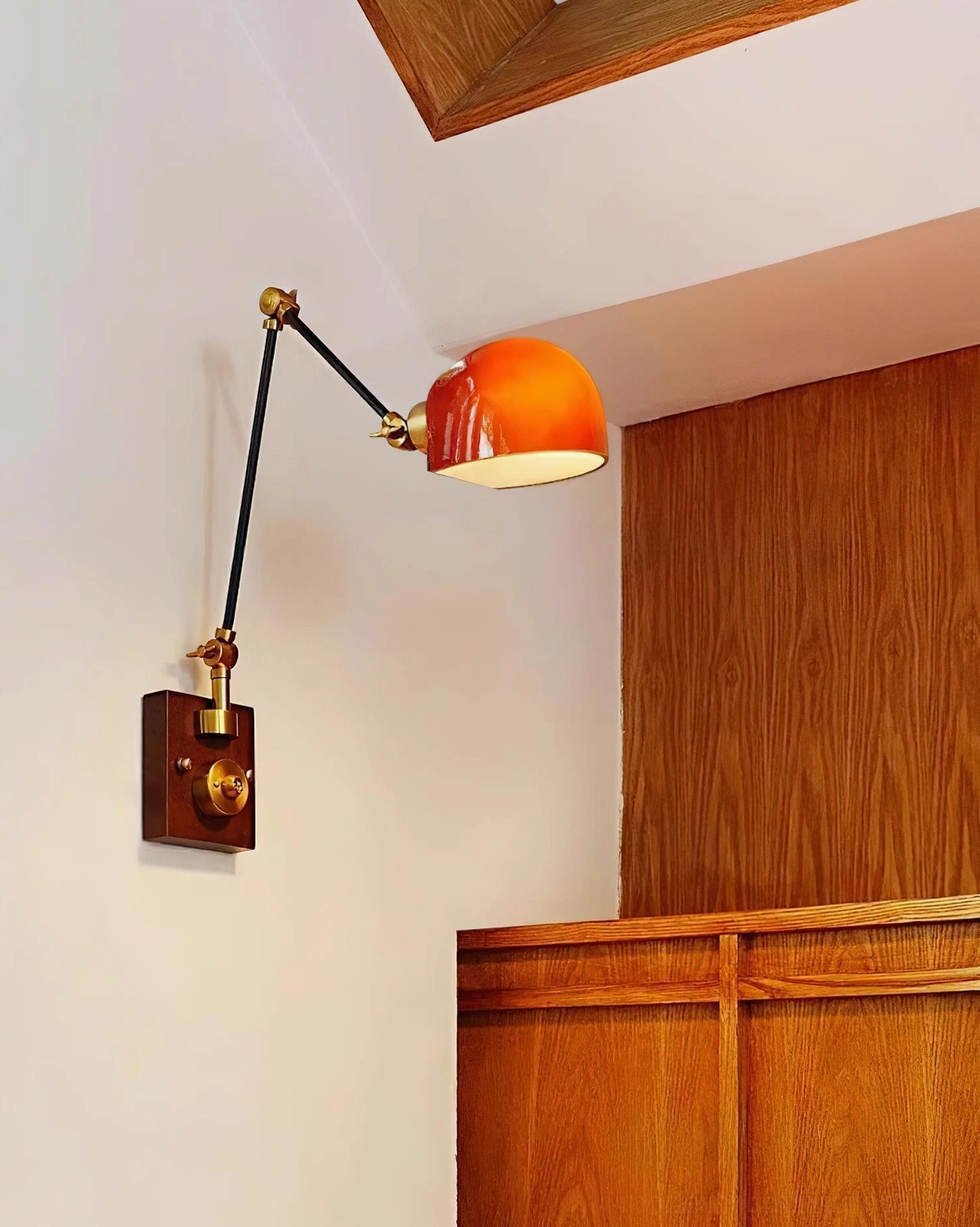 Cordova wall sconce illuminated low-angle view showing red-orange dome light output