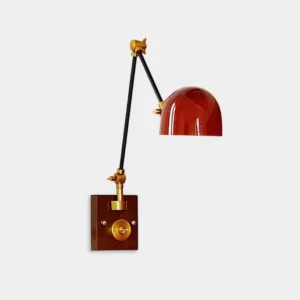 Cordova adjustable wall sconce with red dome shade and articulating arms, front three-quarter studio view