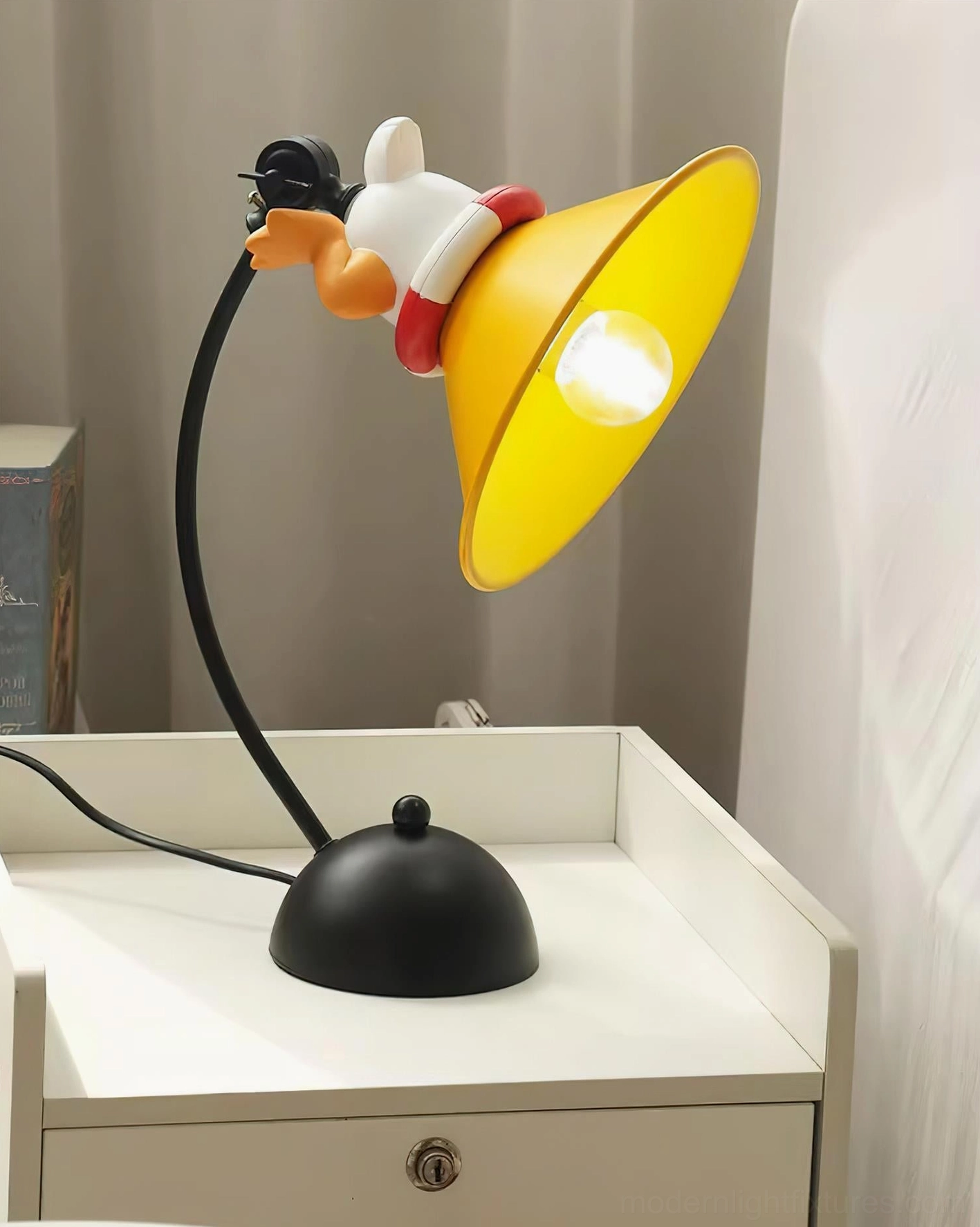 Corgi decorative table lamp close-up detail showing matte yellow shade, flexible gooseneck, and artistic resin character design for contemporary interiors