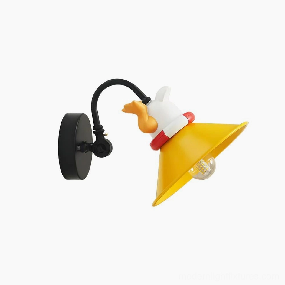 Modern cartoon corgi wall sconce with black and yellow color combination mounted on bedroom wall with ambient lighting