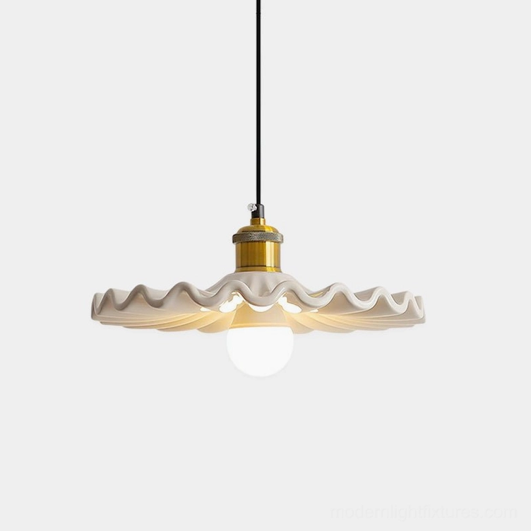 Corolla ceramic pendant light with scalloped ruffled shade and brass fixture, frontal studio view