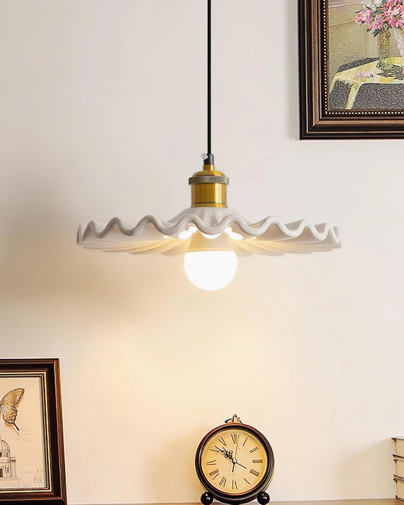 Corolla ceramic pendant light in vintage living room with coordinating wall art and table clock, illuminated