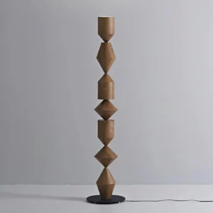 Costantina walnut floor lamp three-quarter angle minimal grey background modern wabi-sabi