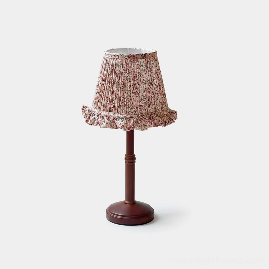 Cottage floral pleated fabric table lamp with walnut wood base, front studio view on white background