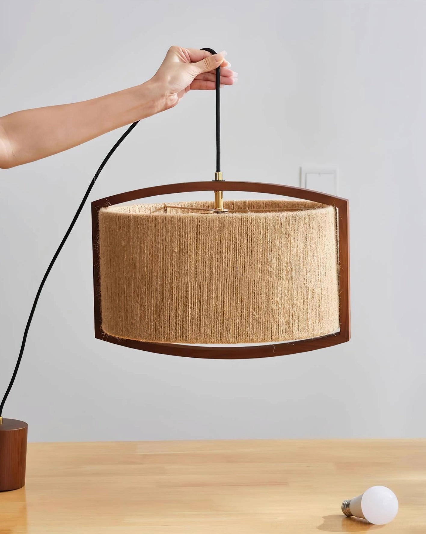 Cotton thread pendant lamp with walnut wood bracket, eye-level display showing construction details and spare bulb