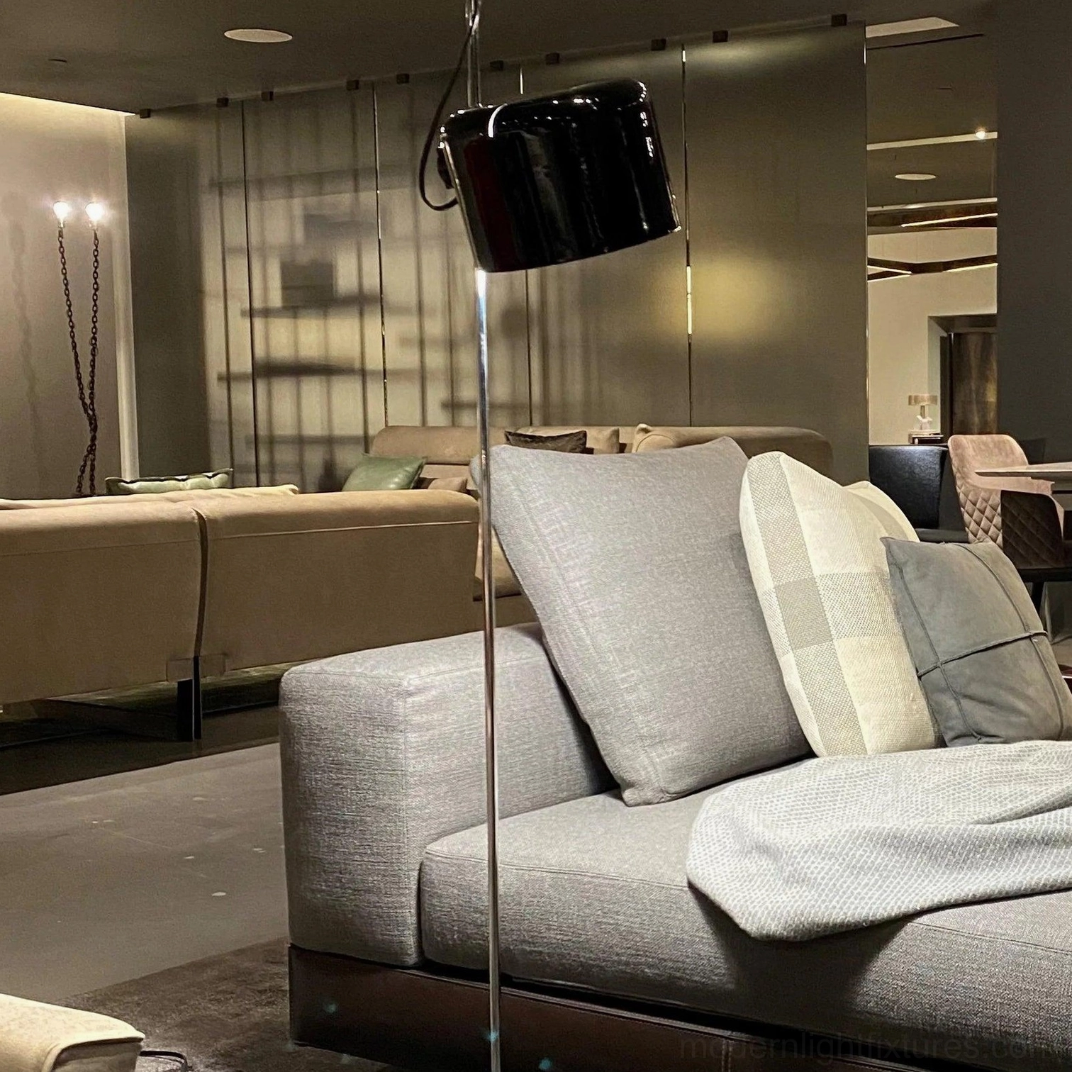 Modern articulated floor lamp demonstrating flexible head adjustment in Scandinavian-style living space