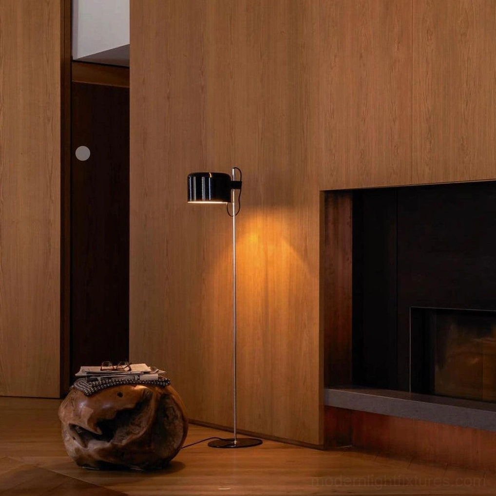 Coupé adjustable floor lamp close-up showing movement mechanism and polished metal construction