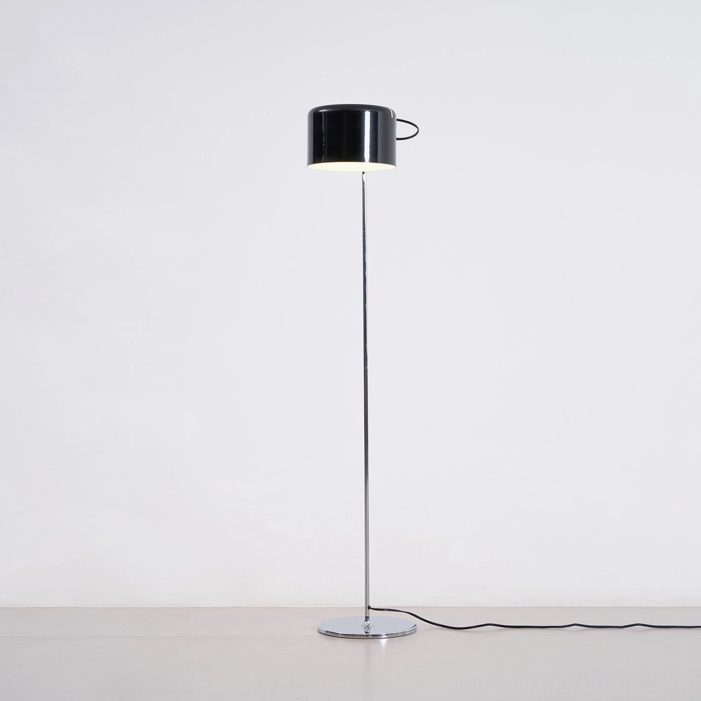 Modern articulated floor lamp with adjustable head tilt and vertical movement capability
